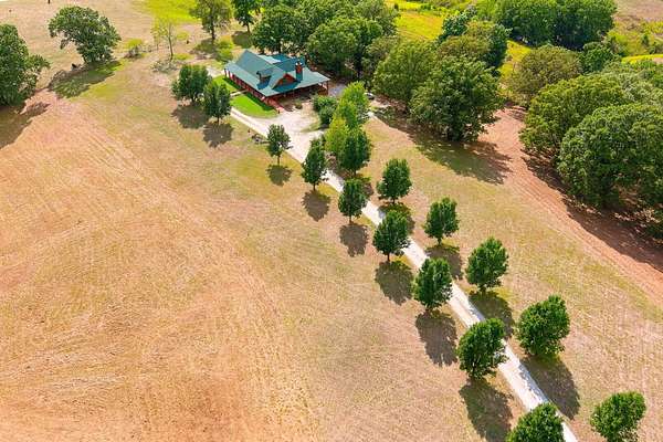 7 Acres of Land with Home for Sale in Reeds Spring, Missouri