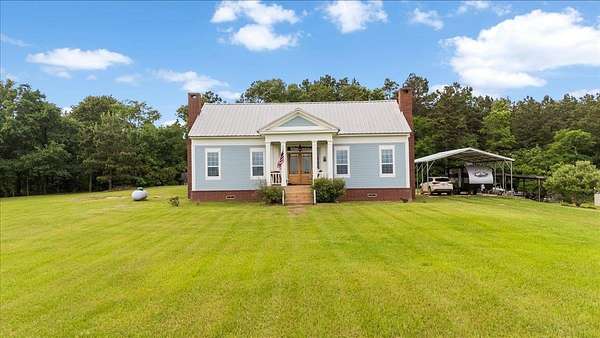 48 Acres of Recreational Land with Home for Sale in Cushing, Texas