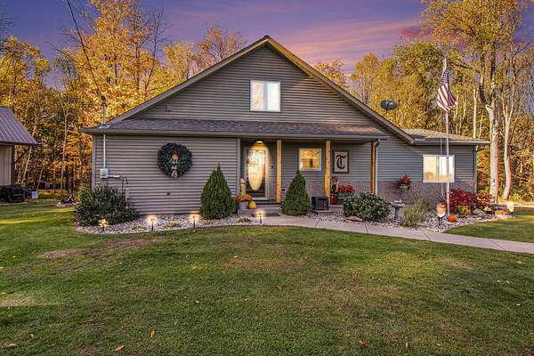 12.8 Acres of Recreational Land with Home for Sale in Stanton, Michigan