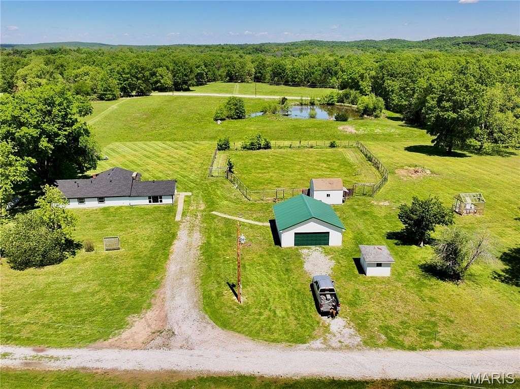 9.14 Acres of Land with Home for Sale in Collins, Missouri