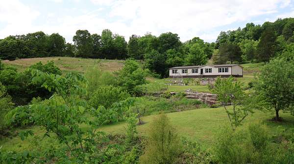 164 Acres of Recreational Land with Home for Sale in Melbourne, Arkansas