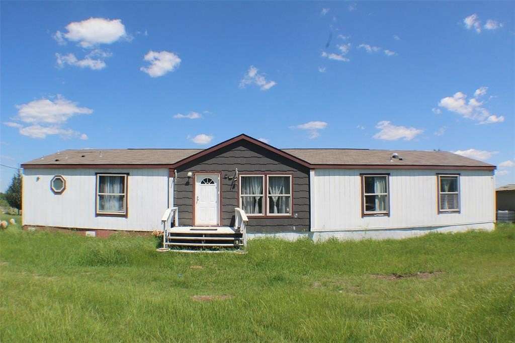10 Acres of Land with Home for Sale in Scurry, Texas