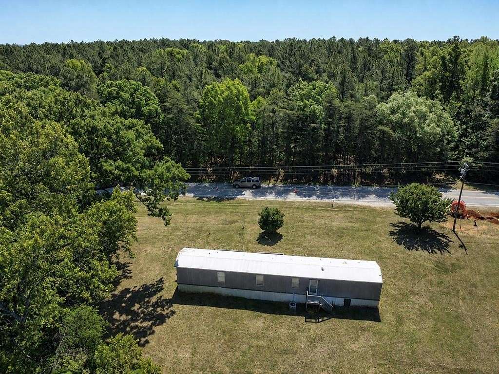 6.77 Acres of Land with Home for Sale in Chase City, Virginia