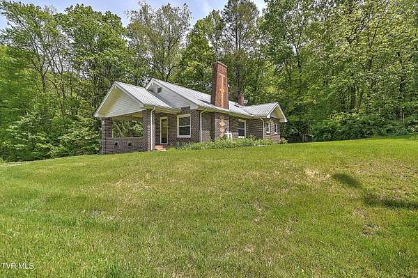 61.6 Acres of Recreational Land with Home for Sale in Roan Mountain, Tennessee