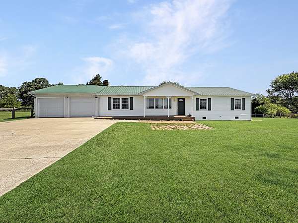 3.56 Acres of Land with Home for Sale in Tennessee Ridge, Tennessee