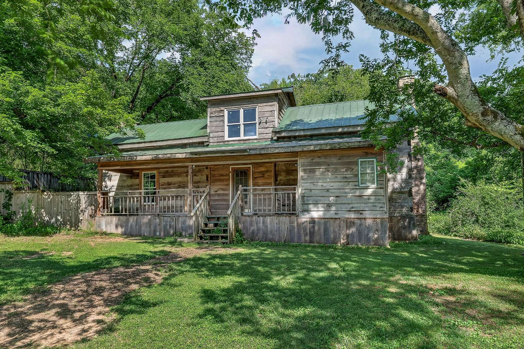 55.5 Acres of Land with Home for Sale in Dellrose, Tennessee