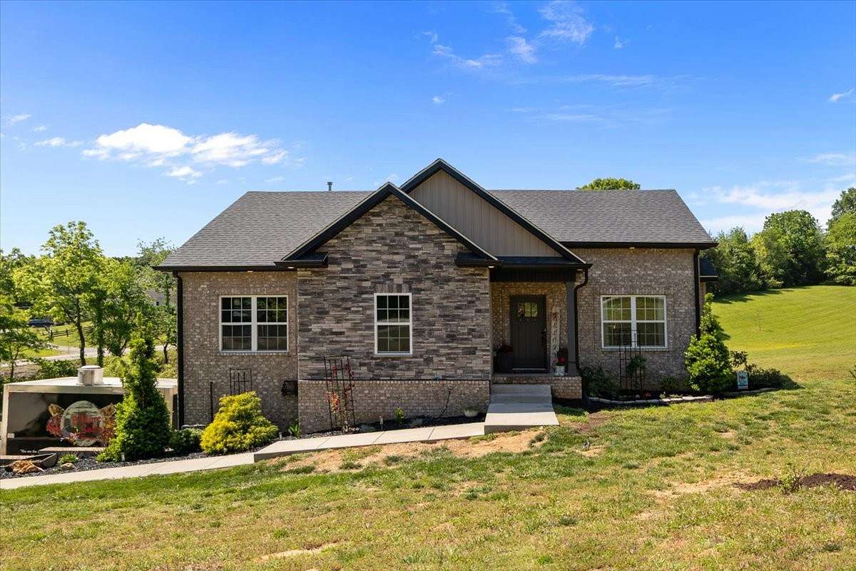 1.64 Acres of Land with Home for Sale in Cunningham, Tennessee