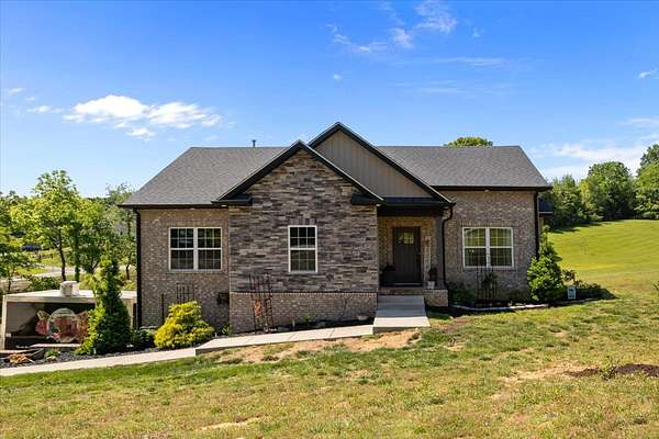 1.64 Acres of Land with Home for Sale in Cunningham, Tennessee