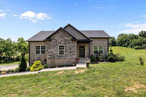 1.64 Acres of Land with Home for Sale in Cunningham, Tennessee