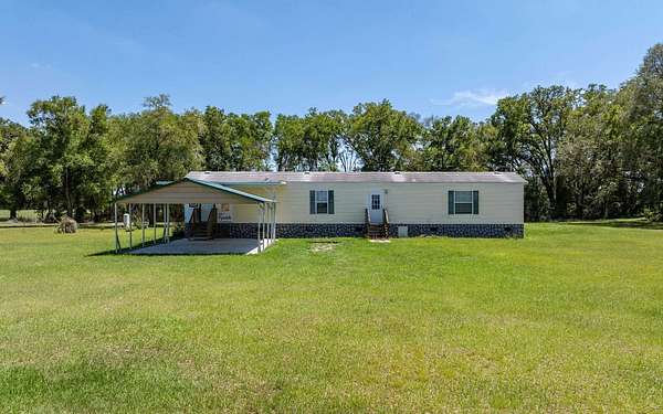 7.33 Acres of Land with Home for Sale in Fort White, Florida