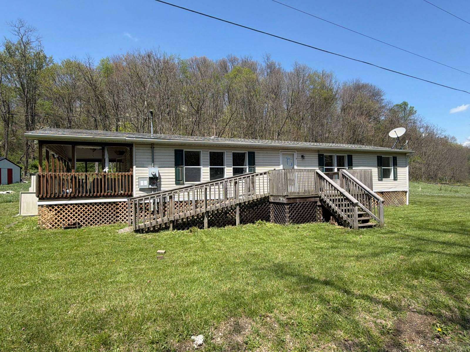 17.1 Acres of Land with Home for Auction in Cambridge, Ohio
