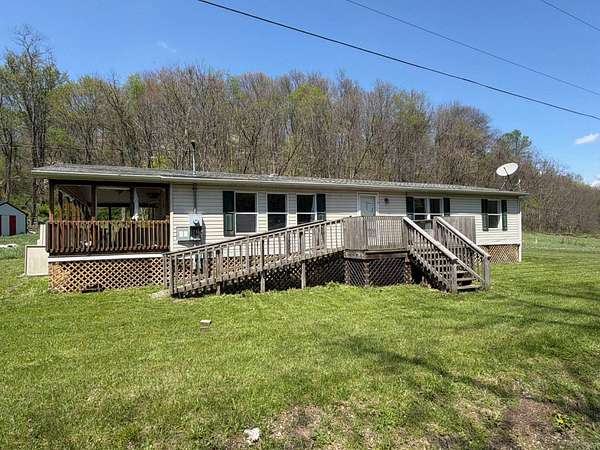 17.1 Acres of Land with Home for Auction in Cambridge, Ohio
