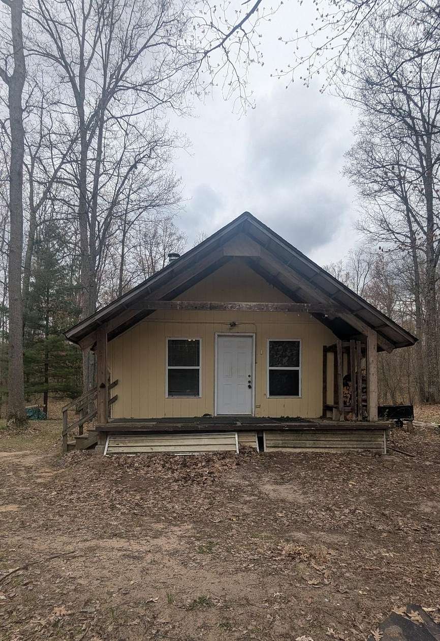 159 Acres of Recreational Land with Home for Sale in Brethren, Michigan