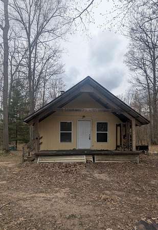 159 Acres of Recreational Land with Home for Sale in Brethren, Michigan