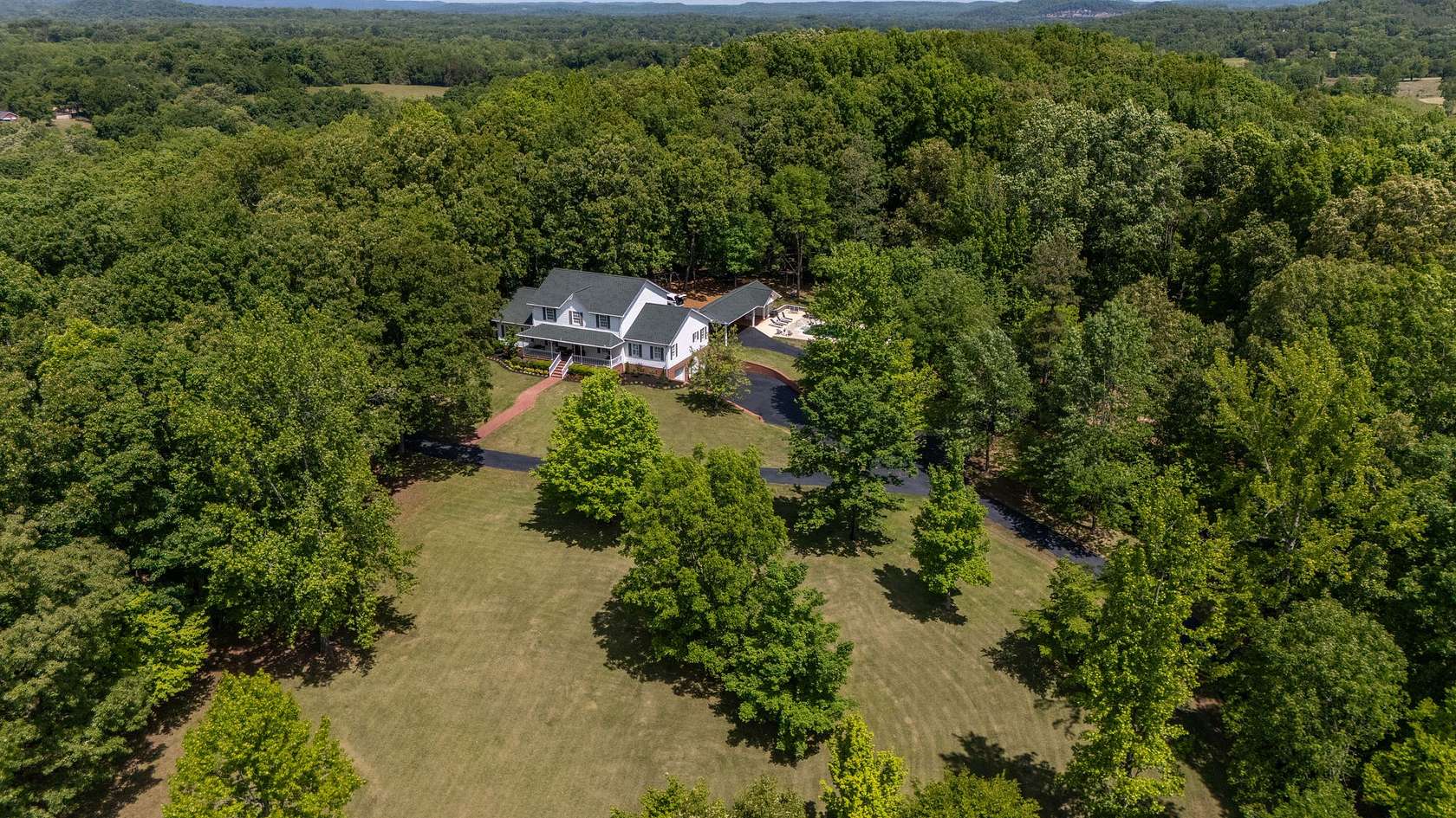 25.7 Acres of Recreational Land with Home for Sale in Clifton, Tennessee