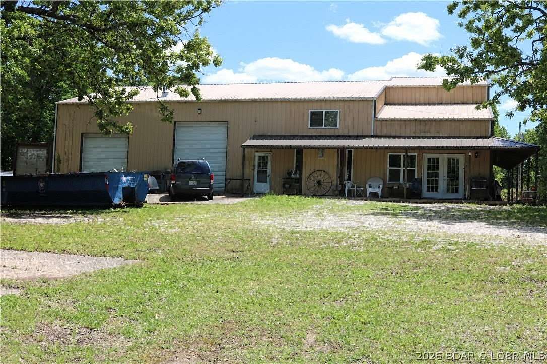 7 Acres of Land with Home for Sale in Laurie, Missouri