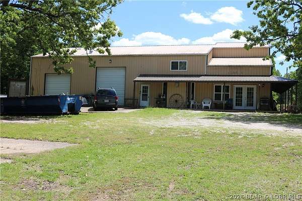 7 Acres of Land with Home for Sale in Laurie, Missouri