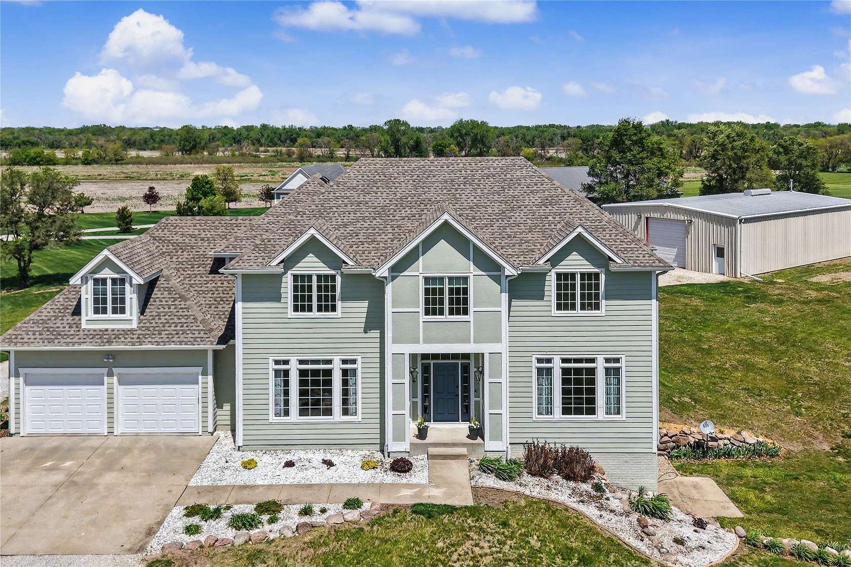 5 Acres of Land with Home for Sale in Dallas Center, Iowa