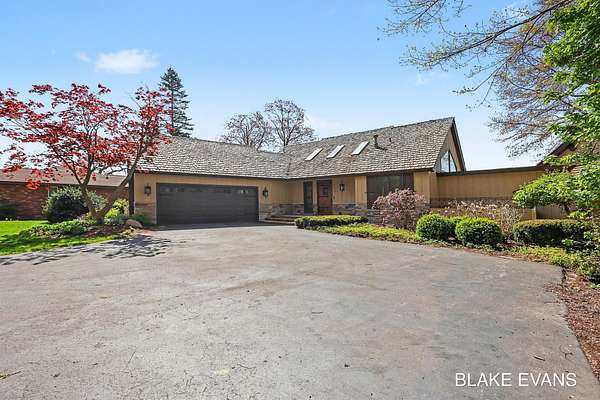 1.5 Acres of Land with Home for Sale in Norton Shores, Michigan