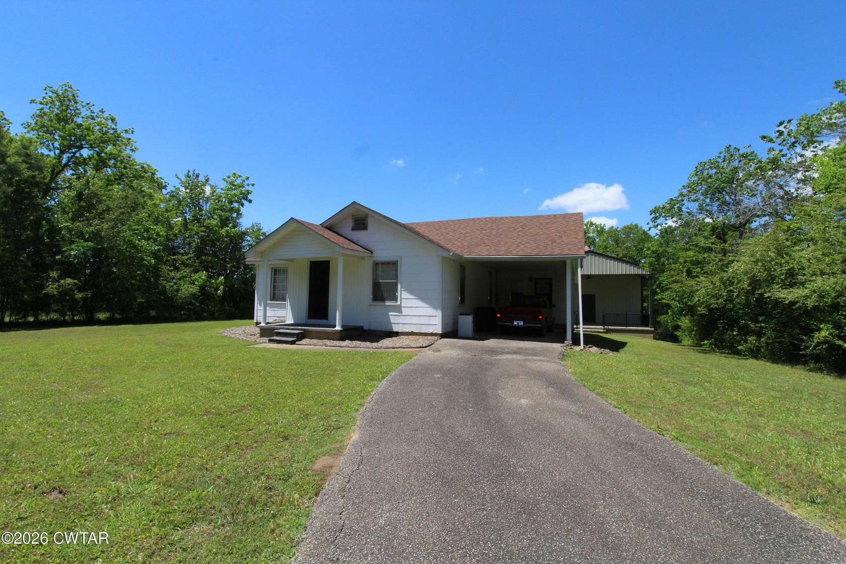 132 Acres of Land with Home for Sale in Darden, Tennessee
