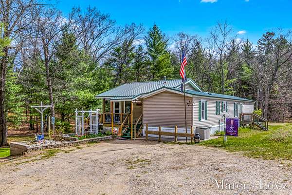 30.3 Acres of Recreational Land with Home for Sale in Chase, Michigan