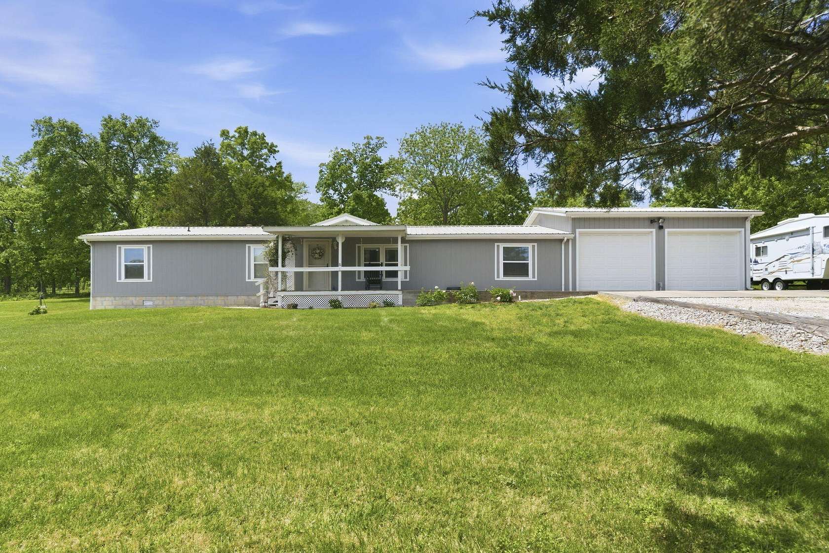 20.3 Acres of Land with Home for Sale in Humansville, Missouri