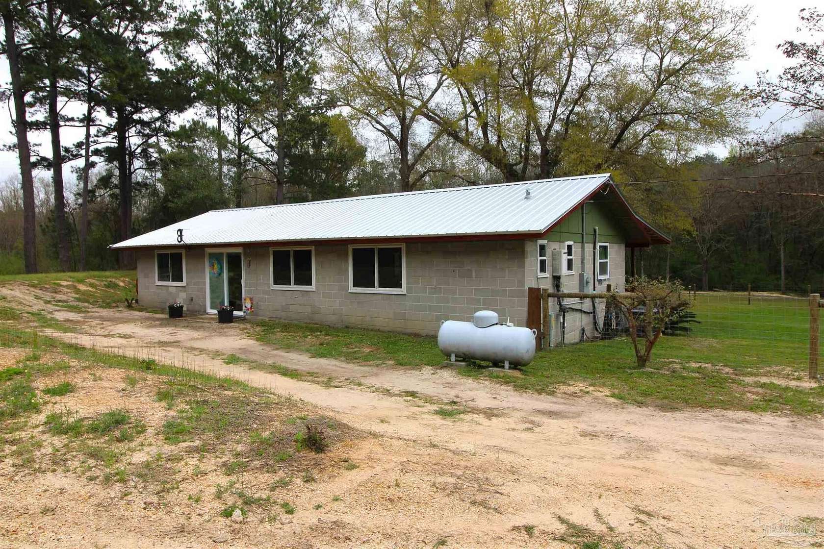 15.7 Acres of Land with Home for Sale in Century, Florida