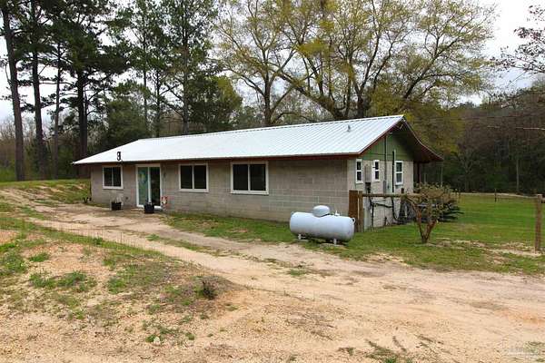 15.7 Acres of Land with Home for Sale in Century, Florida