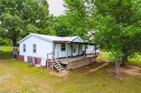 7 Acres of Land with Home for Sale in Muldrow, Oklahoma