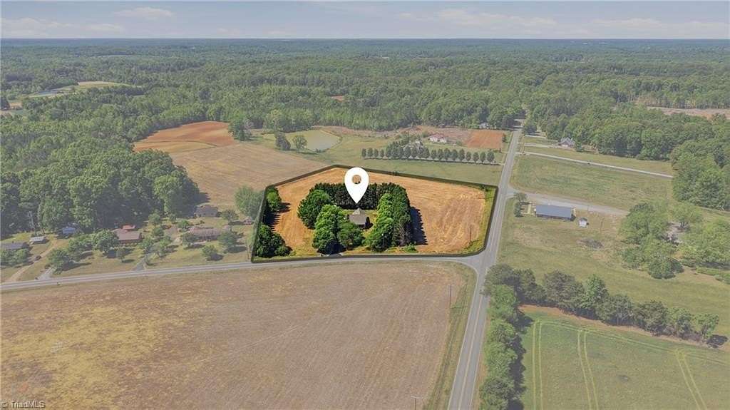5.27 Acres of Land with Home for Sale in McLeansville, North Carolina