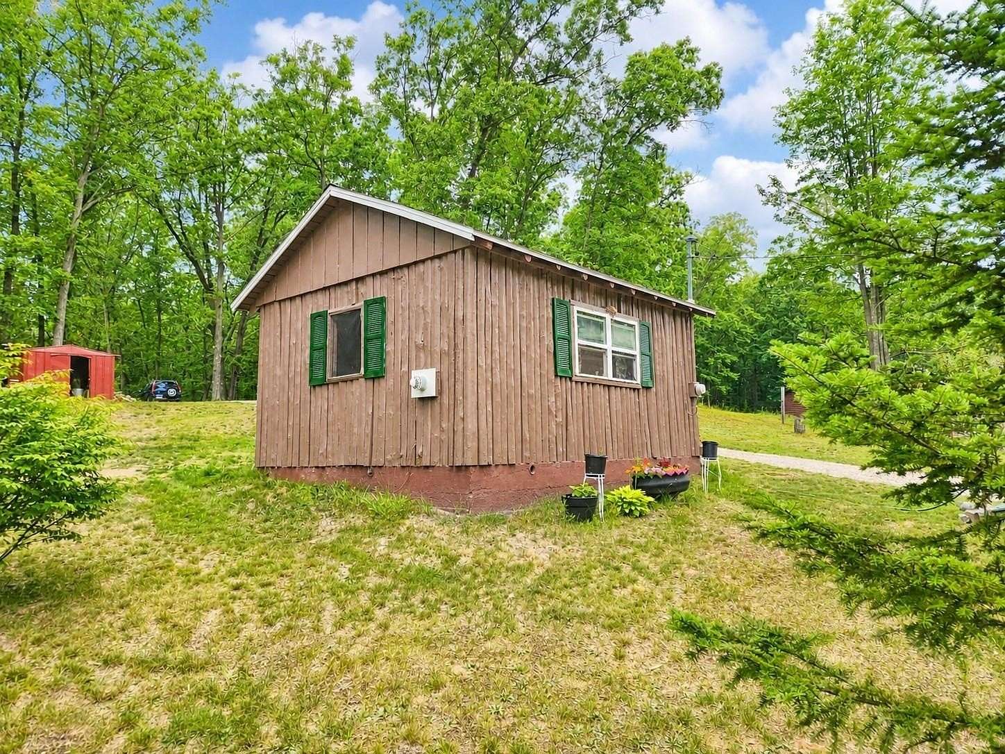 1.24 Acres of Land with Home for Sale in Harrison, Michigan