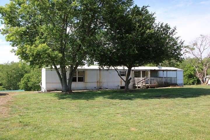 2.39 Acres of Land with Home for Sale in Scottsville, Kentucky