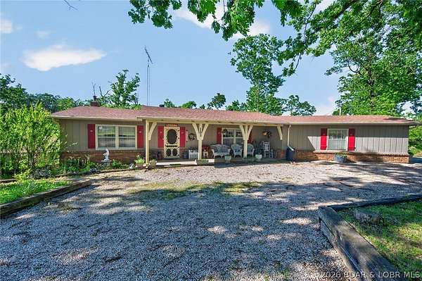 1.72 Acres of Land with Home for Sale in Laurie, Missouri