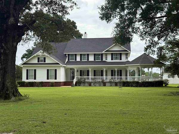 17.1 Acres of Improved Mixed-Use Land for Sale in Jay, Florida