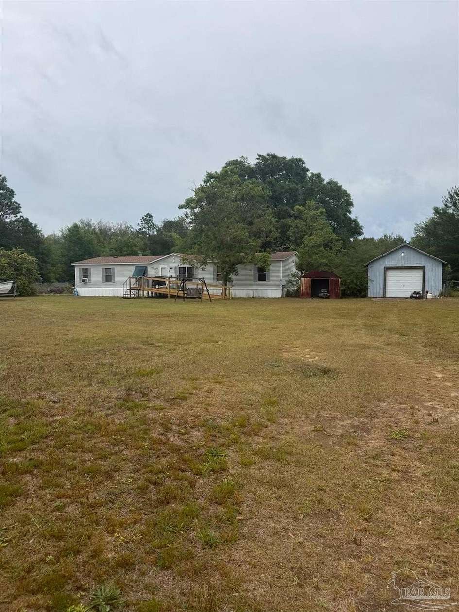 3.27 Acres of Land with Home for Sale in Milton, Florida