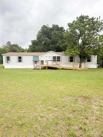 3.27 Acres of Land with Home for Sale in Milton, Florida