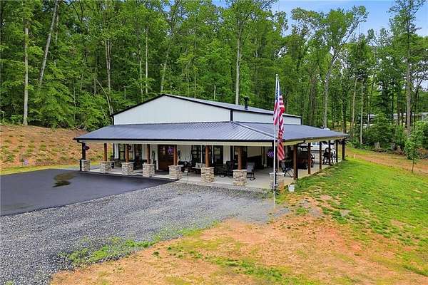 13.6 Acres of Land with Home for Sale in Ball Ground, Georgia