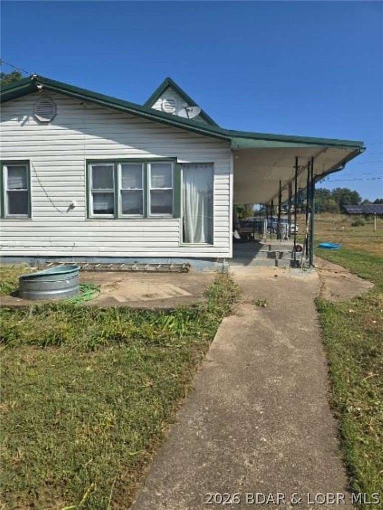 14.2 Acres of Land with Home for Sale in Versailles, Missouri