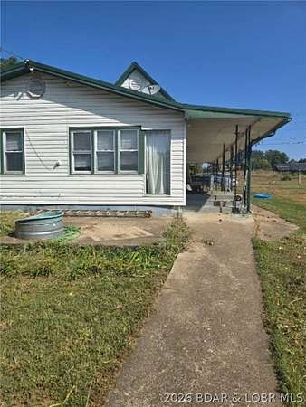 14.2 Acres of Land with Home for Sale in Versailles, Missouri