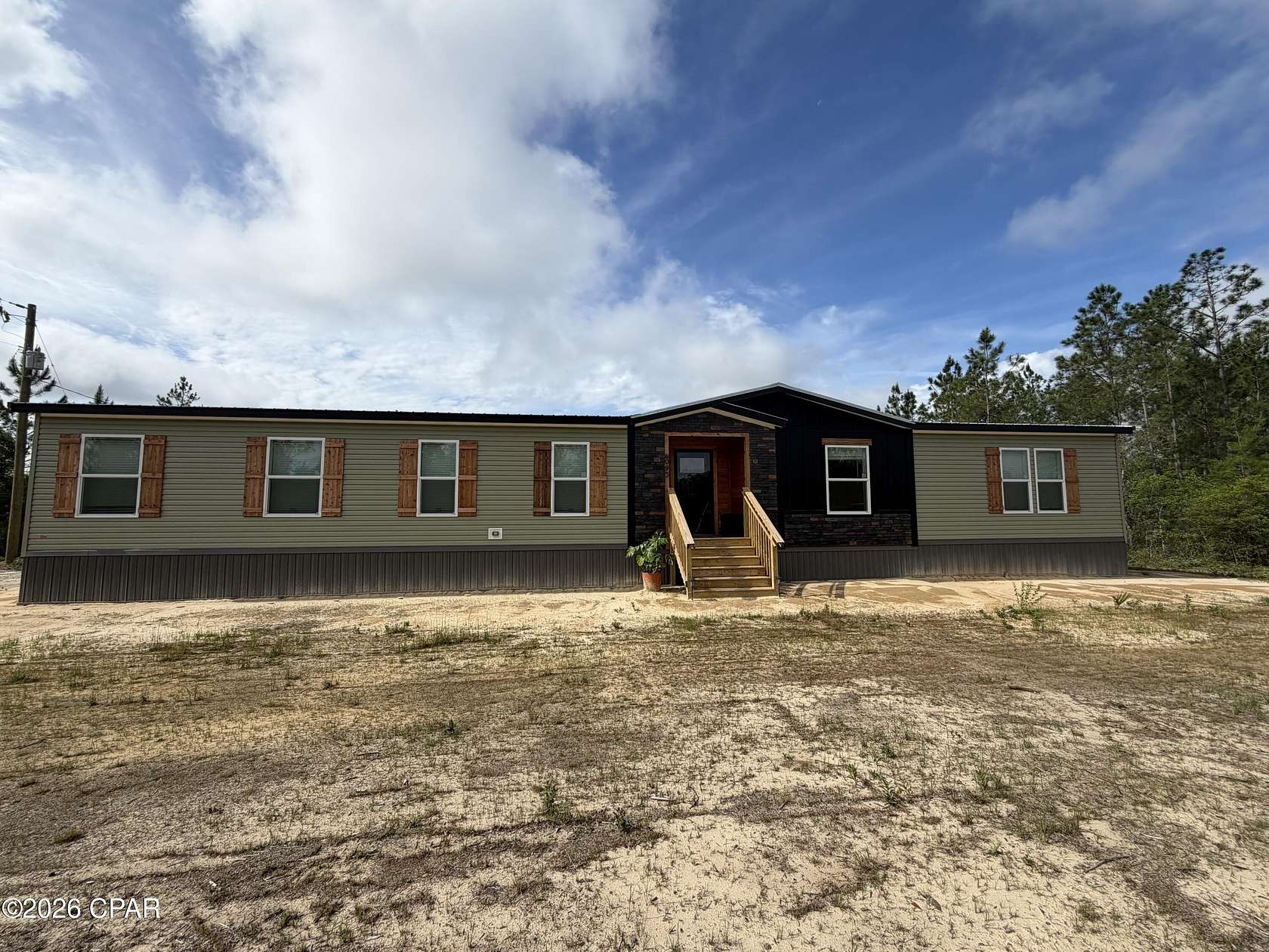 10 Acres of Recreational Land with Home for Sale in Altha, Florida