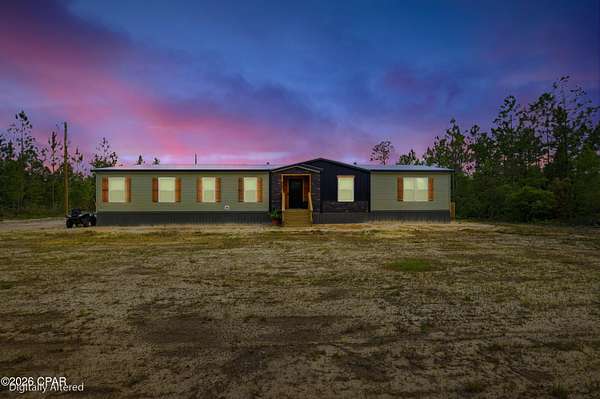 10 Acres of Recreational Land with Home for Sale in Altha, Florida