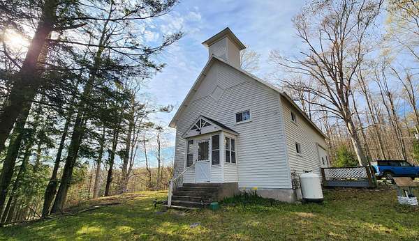3.1 Acres of Land with Home for Sale in Alanson, Michigan