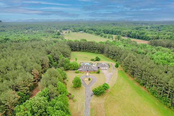 80 Acres of Recreational Land with Home for Sale in Florence, Alabama
