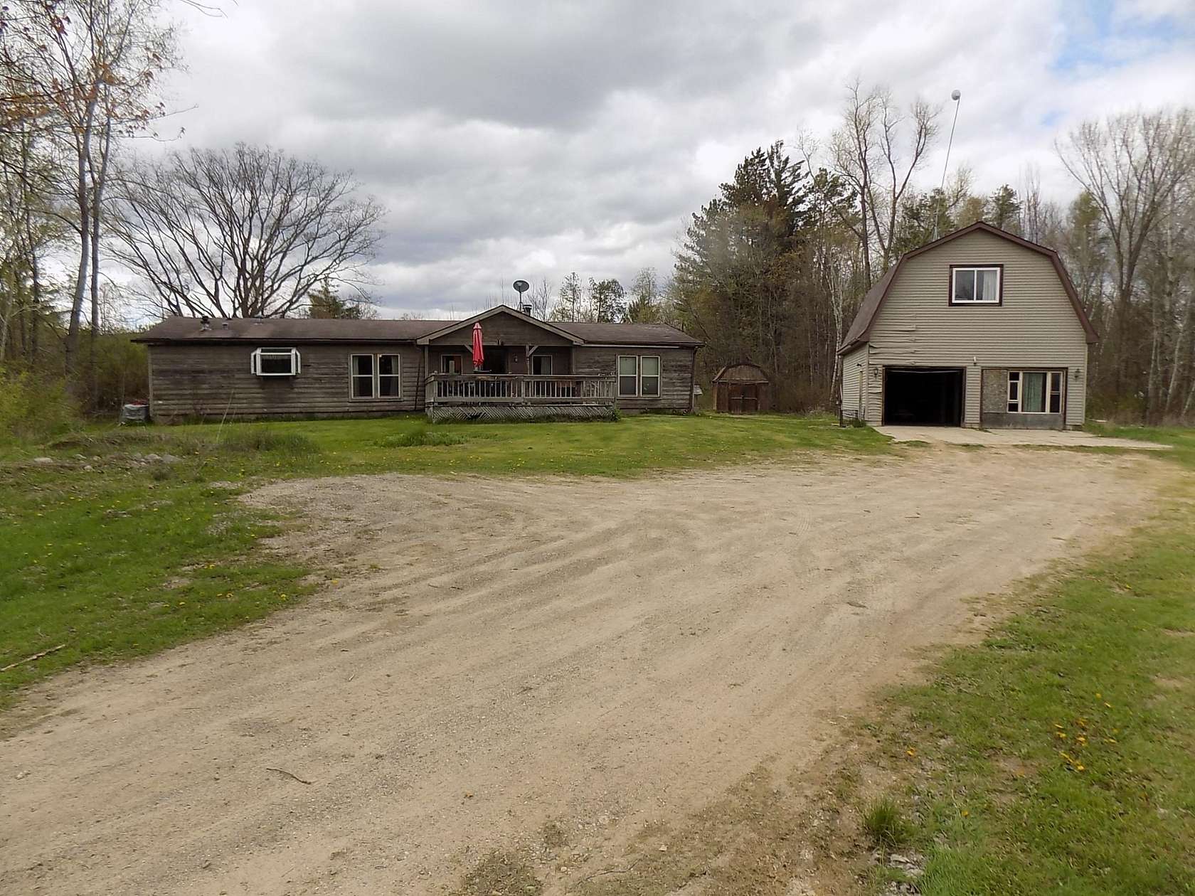 21 Acres of Recreational Land with Home for Sale in Clare, Michigan