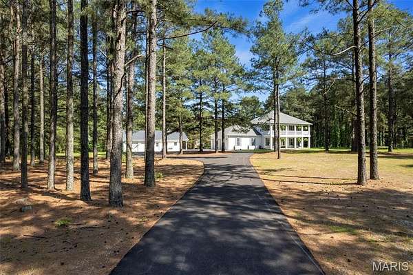 9.17 Acres of Land with Home for Sale in Benton, Missouri