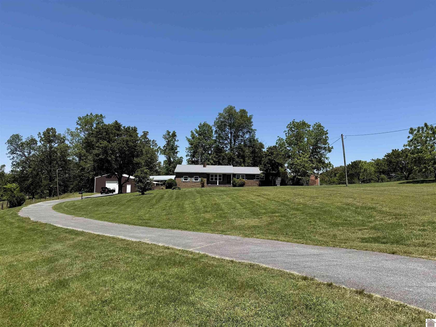7.48 Acres of Land with Home for Sale in Mayfield, Kentucky