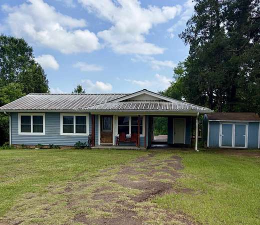 3 Acres of Land with Home for Sale in Carthage, Texas
