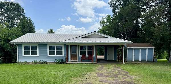 3 Acres of Land with Home for Sale in Carthage, Texas