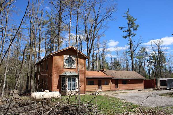 5 Acres of Land with Home for Sale in Comins, Michigan