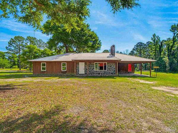 9.86 Acres of Land with Home for Sale in Century, Florida